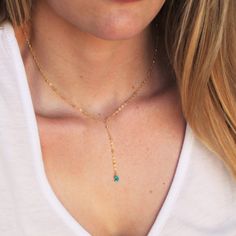 "Our lariat necklace is perfect minimalist jewelry. This dainty necklace is perfect with your favorite tee or your little black dress. A natural turquoise drop adorns a 14kt gold filled satellite chain.  D E T A I L S *Natural Arizona turquoise chips *2 inch drop  *Dainty satellite chain *100% 14kt gold dainty link chain  LENGTH *The standard length is normally 18\". *Model is wearing a 16\" in Photos. HOW TO PERSONALIZE *Select your choices from the drop down menu to create your custom design. Turquoise Lariat Necklace As A Gift, Turquoise Lariat Necklace Gift, Adjustable Dainty Lariat Necklace, Turquoise Lariat Necklace With Adjustable Chain, Elegant Turquoise Lariat Necklace With Adjustable Chain, Elegant Turquoise Lariat Necklace For Gift, Necklace Minimalist Jewelry, Dainty Necklaces, Gold Filled Necklace