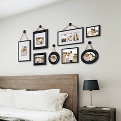 a bedroom with pictures hanging on the wall