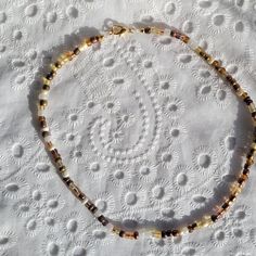 Sweet champagne, cream & brown colored short seed bead necklace, with snake print beads, & gold plated fasteners. Make sure you measure your neck before you buy, as this item is not adjustable! *All pieces are sterilized with isopropyl alcohol before shipping. Brown Seed Bead Necklace, Diy Seed Bead Necklace, Seed Bead Necklace Ideas, Bead Buddies, Sweet Champagne, Yellow Snake, Brown Beaded Necklace, Choker Necklace Gold, Isopropyl Alcohol