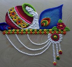 this is an image of a peacock made out of beaded threads and beads