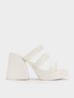 Invoke 90s nostalgia with these Tattie platform mules. The chunky platform silhouette is given a charming tactility with triple puffy straps, creating a standout pair that is sure to captivate. With its clean white finish, it will brighten up any ensemble and become the instant highlight of your look. 10cm platforms make these mules impossible to miss -- they will make you stand out anywhere. White Mules, Platform Mules, Pu Heels, 90s Nostalgia, Charles Keith, Chunky Platform, Platform Heels, To Miss, Sales Gifts