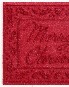 a red door mat with the words happy new year written in cursive writing