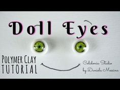 the words doll eyes are written in pink and green letters with two green eyes on them