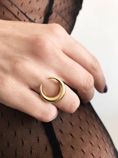 This ring is a piece from Keras collection.Sculptured and casted in solid sterling silver 925 and then double gold plated with 22k gold.Very nice and important weight. The crescent is 20mm (0.787 inch) All of my jewelry is handmade please allow for small variances from piece to piece ,as this is a feature of owning one of a kind original handmade jewelry. Feel free to ask me for personal orders . -22k gold platted Sterling silver 925 You may also like on bright silver https://www.etsy.com/listin Celestial Style Open Ring With Moon Charm, Mystical Crescent Rings With Moon Charm, Hand Forged Celestial Round Rings, Hand Forged Celestial Rings, Mystical Crescent Moon Charm Rings, Moon Phase Open Ring For Promise, Elegant Crescent Moon Charm Rings, Mystical Crescent Ring As A Gift, Mystical Crescent Rings Perfect For Gifts