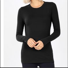 Black Long Sleeve Round Neck Microfiber Tee. 90% Polyester & 10% Spandex. This Will Quickly Become Your Favorite Tee. This Listing Is For Black Only, Other Colors Available In Separate Listings. Casual Black Long Sleeve Top With Thumbholes, Fitted Black Long Sleeve Elastane Top, Black Elastane Tops For Layering, Black Stretch Top With Thumbholes, Black Elastane Tops For Workout, Fitted Black Workout Top, Black Elastane Workout Top, Black Long Sleeve Crew Neck Top With Thumbholes, Black Crew Neck Tops In Elastane