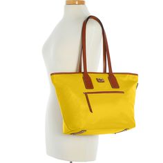 Sporty and Classic    This sporty classic holds everything you need for the morning commute or extra clothes for a trip to the gym. All-weather nylon, Vacchetta leather trim, and heritage details exude signature all-American style. Classic Nylon Shoulder Bag For Shopping, Casual Nylon Bag With Leather Trim, Yellow Coated Canvas Shoulder Bag For Travel, Yellow Coated Canvas Bag For Travel, Yellow Coated Canvas Bags For Travel, Travel Nylon Shoulder Bag With Leather Trim, Travel Bags With Leather Trim And Nylon Material, Yellow Waterproof Travel Bag, Waterproof Leather Shoulder Bag For Travel