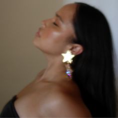 Meet our Star earrings from the Holiday Collection. Your perfect pair of statement earrings for NYE and holiday parties. Styling tip: wear this with an elegant black gown. Gold Plating with CZ Stone. Clip on earrings. Elegant Star-shaped Crystal Earrings For Party, Elegant Star Charm Earrings For Party, Elegant Party Earrings With Star Charm, Sparkling Star-shaped Crystal Earrings For Party, Sparkling Star Crystal Earrings For Party, Dangle Earrings With Star Charm For Party, Silver Star-shaped Crystal Earrings For Party, Sparkling Star-shaped Crystal Earrings, Elegant Star-shaped Sparkling Crystal Earrings