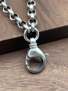 This is 7mm Rolo chain with a circle spring clasp connect to a big lobster clasp. It can take off or hang a pendant. PRODUCT DESCRIPTION -Materials:Silver 925 -Color:White silver/Oxidized(Dark silver) -Width:7mm(Can be Personalized) -Length:Any length (Can be personalized length) -Clasp can change to other designs. -Free Shipping, -Free Gift Box. If you need to make a custom order,please contact us.Thank you. Silver Metal Necklace With Carabiner Clasp, Silver Necklace With Carabiner Clasp In Metal, Classic Pendant Chain Necklace With Lobster Clasp, Silver Necklaces With Hook And Links For Everyday, Everyday Silver Necklace With Hook And Links, Silver Link Chain Necklace With Carabiner Clasp, Metal Chain Necklace With Round Pendant And Lobster Clasp, Metal Link Chain Necklace With Sterling Silver Clasp, Silver Link Jewelry With Carabiner Clasp