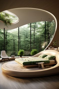 a circular bed sitting in the middle of a living room next to a large window