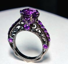 Luxury Purple Amethyst Spiritual Ring, Purple And Black Ring, Luxury Purple Amethyst Ring In Sterling Silver, Purple Ruby Ring With Accent Stones For Anniversary, Luxury Round Amethyst Ring With Vs Clarity, Amethyst Rings With Vs Clarity, Sterling Silver Purple Ruby Ring For Promise, Purple Ruby Ring In Sterling Silver For Promise, Luxury Purple Sterling Silver Ring