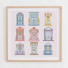 a cross stitch pattern with different types of doors and windows on pink background, framed in wooden frame