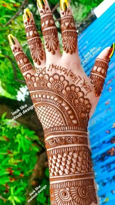 the hand is decorated with henna designs