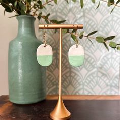 Discover the perfect blend of everyday elegance and bohemian chic with our handcrafted ceramic earrings. These pieces are made in small batches from porcelain clay, featuring hand-painted glazes and gold-plated or stainless steel hoops. Since all items are handmade, please expect slight variations from what is photographed.  Due to this handcrafted nature, no two pairs are exactly alike, making each piece as unique as the person wearing them. Lightweight and hypoallergenic, these earrings offer comfort and style, perfect for daily wear or special occasions. Packaged beautifully, they make an ideal gift or personal accessory to elevate any outfit with a touch of artisan charm. Handmade Minimalist Oval Earrings, Handmade Oval Minimalist Earrings, Minimalist Handmade Oval Earrings, Minimalist Bohemian, Matte Green, Ceramic Earrings, Fort Walton Beach, Everyday Elegance, Ceramic Earring