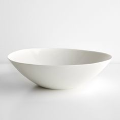 a white bowl sitting on top of a table