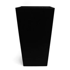 a tall black vase sitting on top of a white floor