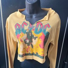 Yellow Acdc Crop Top. Perfect For Festival Wear And Everyday Wear. Fun And Versatile Looks Can Be Made With This Cute Top! New Never Worn Trendy Yellow Long Sleeve T-shirt, Trendy Long Sleeve Yellow T-shirt, Casual Yellow T-shirt For Fall, Casual Yellow Tops For Fall, Retro Yellow Long Sleeve Tops, Retro Mustard Long Sleeve Tops, Mustard Retro Long Sleeve Tops, Retro Long Sleeve Yellow Tops, Trendy Yellow Long Sleeve Tops