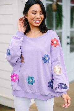 This adorable sweatshirt is just my type! It's cute! It's fun! But most importantly, it's comfy! This sequin floral sweatshirt is absolutely perfect for spring! This sweatshirt features long bubble sleeves, a wide round neckline, and sporadic sequined flowers.  Material has a generous amount of stretch.Cindy is wearing the small. Relaxed Fit Spring Sweatshirt, Spring Long Sleeve Tops With Sequins, Long Sleeve Sequined Tops For Spring, Fall Cotton Tops With Sequins, Purple Long Sleeve Sweatshirt For Spring, Spring Sequined Crew Neck Top, Spring Sequin Crew Neck Tops, Sequined Crew Neck Tops For Spring, Spring Purple Crew Neck Sweatshirt