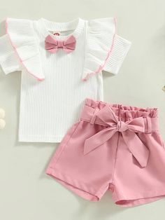 Introducing the perfect summer outfit for your little girl! With a ruffled bowknot shirt, shorts with a matching belt, and a variety of sizes from 12-24 months to 4T. Made with lightweight and breathable cotton and polyester materials, this casual set is perfect for the hot summer months. With its solid color and contrast details, your child will be dressed to impress everywhere she goes! #kidsclothingstore #kidssummer #summerfashiontrends #kidsfashiontrends Ruffle Outfit, Toddler Girl Shorts, Kids Fashion Trends, Dressed To Impress, Perfect Summer Outfit, Kids Fashion Clothes, Summer Fashion Trends, Toddler Boy Outfits, Summer Months