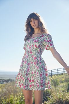 Floral printed mini dress, a gorgeous vine of fragrant flowers, fresh peas & cute bees. This sweet dress has short sleeve, sweet flare and side ties- Fitted bodice with flared skirt - length ends above knee- rounded neckline - short sleeve with slight puff - wide side ties - invisible back zipper - made of a linen viscose blend - available in navy & cream Product Code: PGFY059 Fit And Flare A-line Mini Dress For Garden Party, Floral Print Fit And Flare A-line Mini Dress, Square Neck Mini Dress For Spring Garden Party, Floral Print Fit And Flare Mini Dress, Feminine A-line Mini Dress With Floral Print, Feminine Floral Print Mini Dress For Garden Party, Casual A-line Floral Dress For Garden Party, Cottagecore Floral Dress For Garden Party, Pink Floral Print Fit And Flare Mini Dress