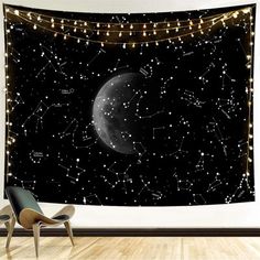 the night sky with stars and planets on it is shown in this wall hanging tapestry