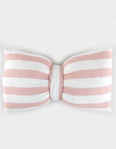 a pink and white striped bow pillow