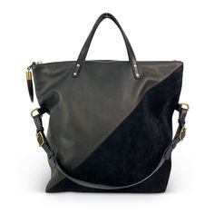 The Morleigh shape redefined. A tote, or a shoulder bag, the morleigh does great as an everyday bag. Half black suede, textured cowhide leather. An interior pocket is accompanied by cotton twill lining, solid brass hardware, and trimmed with our signature Kenyan horn toggle. Luxury Black Suede Bags, Black Leather Bag With Suede Lining, Modern Black Suede Bags, Monica Castiglioni, Black Lizard, Bag Collection, Everyday Bag, The Door, Rebecca Minkoff Hobo