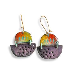 You will get a ton of compliments when you wear these unique spaceship inspired enamelled statement earrings.  The enamel is used in a painterly way for added interest. These lightweight, unusual earrings come with high quality hand formed brass ear wires that clasp so you never have to worry about losing them. What is enamel?   Enamel is made by fusing multiple layers of glass to a prepared metal at a very high heat.  Each earring requires between four to 10 layers of enamel depending on the ef Artsy Enamel Drop Earrings, Multicolor Enamel Jewelry With Ear Wire, Retro Enamel Earrings As Gift, Multicolor Enamel Earrings, Artsy Enamel Earrings As Gift, Unique Enamel Pierced Earrings, Unique Enamel Earrings For Pierced Ears, Unique Red Enamel Earrings, Hand Painted Enamel Artsy Earrings