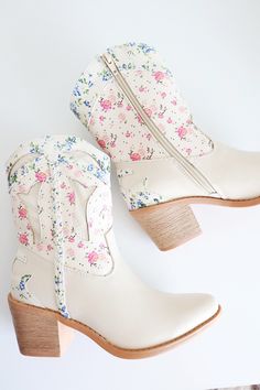 Western style floral boot Flower print and textured upper Braid detail on side Inside Zipper Tapered block heel Boots With Flowers In Them, Floral Cowboy Boots, Graphic Print Top, Floral Boots, Loungewear Sets, Boots And Sneakers, Skirt Leggings, Sleeveless Sweater, Senior Photos