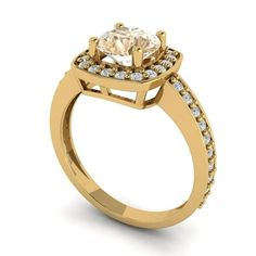 a yellow gold engagement ring with an oval cut diamond surrounded by small white and clear stones