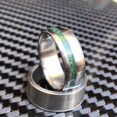 Rush order option: Some of our rings can be expedited from the normal 3 week lead time to either 3 day or same-day shipping with a rush order add on. Rings with these liners cannot be expedited: Tungsten, Ceramic, Stainless steel, Damascus, and coin rings.  All other Liners can be expedited.Link below:https://www.etsy.com/listing/718766382/add-on-rush-order?ga_search_query=add&ref=shop_items_search_1&frs=1This stunning 8mm ring is crafted out of a solid piece of titanium. It has an intense green Gemstone Wedding Band, Coin Rings, Gemstone Wedding, Natural Emerald Rings, Coin Ring, Mystic Topaz, Titanium Rings, Tungsten Ring, Domed Ring