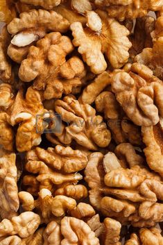 walnuts are piled on top of each other and ready to be eaten for consumption