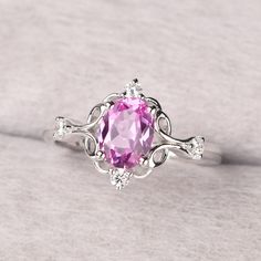 ◆ The ring is handcrafted from sterling silver and decorated with a dazzling 8*6 mm pink sapphire and CZs. It is suitable for engagement/anniversary/daily occasion. ◆ Production Description: Main stone Type: Lab Pink Sapphire Main Stone Shape: Oval Cut Main Stone Size: 8*6 mm(1.75ct) Side stone: CZ Metal: 925 Sterling silver - Other options available in the drop down menu ◆ Customization: √Free for Add Engraving √Other Metal Type Available √Other Gemstones & Shapes Available √Personalization Req Elegant Pink Sapphire Wedding Birthstone Ring, Pink Sapphire Birthstone Ring With Accent Stones For Wedding, Wedding Pink Sapphire Birthstone Ring With Accent Stones, Pink Sterling Silver Diamond Ring With Accent Stones, Pink Birthstone Ring With Accent Stones For Formal Occasions, Anniversary Pink Ruby Ring With Center Stone, Pink Sapphire Ring With Accent Stones For Wedding, Pink Birthstone Ring With Center Stone For Formal Events, Pink Birthstone Ring With Center Stone For Formal Occasions