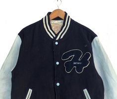 PLEASE ASK ANY QUESTION BEFORE BUYING THIS IS USED CLOTHING PLEASE DONT EXPECTED IT TO BE LIKE NEW OR IN PRISTINE CONDITION Vintage 90s Harvard University Button Down Varsity Jacket Blue Colour Wool Sweater Size Large Fit To Medium tag Harvard material Wool 100% saiz on tag L (Large) fit To Medium Mesasures About ( Approximately) -Armpit to Ampit : 22.5 inch -Length (back collar down) : 25 inch Condition : used good condition 7.5/10 **No Tears And No Stains** **Have a one Hole see a picture deta Blue Varsity Jacket With Button Closure For Streetwear, Blue Varsity Jacket For Streetwear, Blue Buttoned Outerwear For Streetwear, Winter Streetwear Button-up Varsity Jacket, Vintage Varsity Jacket With Button Closure For Winter, Vintage Winter Varsity Jacket With Button Closure, 90s Style Button Closure Streetwear Outerwear, Vintage Varsity Jacket With Button Closure For Streetwear, Retro Buttoned Outerwear For Streetwear