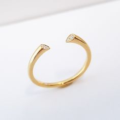 "★ ★ ★ Made with solid gold to ensure the strength of the ring.★ ★ ★ This diamond cuff ring, part of our \"Minimal Collection\" is a delicate, fashion piece to wear as well as an index ring or knuckle ring. Use as a standalone piece or with stacking rings. Item Details ❤ Made to Order ✔ Available Gold Color: Rose Gold, Yellow Gold, White Gold, ✔ Number of Diamonds: 4, total carat weight: 0.03Ctw, ✔ Diamond Color: G Color ✔ Diamond Clarity: VS ✔ Band details: Top Width: 2.4mm Thickness: 3.0mm Bot Cuff Wedding Band, Delicate Fashion, Index Ring, Open Diamond Ring, Open Wedding Band, Diamond Cuff Ring, Minimal Ring, Knuckle Ring, Cuff Ring