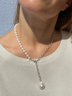 Asymmetric pearl and chain necklace, that mixes classic with a modern twist. Made of white round freshwater pearls and 925 silver chain, finished with beautiful baroque pearl.  MATERIAL Turquoisd, Freshwater pearls, gold vermeil findings (18k gold over sterling silver). SPECIFICATIONS Length: 49 cm and you can regulate it at any desirable length using lobster claw clasp Turquoise beads measure 10 mm One of a kind piece Handmade in Spain Necklace comes in a gift box Worldwide shipping with regist Lariat Necklace With Baroque Pearl Chain, White Lariat Pearl Necklace, White Baroque Pearl Chain Necklace With Pearl Drop, White Pearl Long Necklace With Clavicle Chain, White Baroque Pearl Drop Chain Necklace, White Baroque Pearl Lariat Necklace, Silver Lariat Pearl Chain Necklace, White Baroque Pearl Necklace With Chain, White Pearl Lariat Necklace With Clavicle Chain