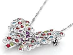 0.24ctw Round Glacier Topaz™, 0.17ctw Round Swiss Blue Topaz, 0.32ctw Round African Amethyst, 1.05ctw Round Rhodolite, 0.26ctw Round Manchurian Peridot™, With 0.91ctw Round White Zircon Rhodium Over Sterling Silver Butterfly Pendant Brooch With 18"Singapore Chain. Measures Approximately 1.41"L x 1.24"W. 3mm bail. Lobster clasp with 2"extender. Accent stones primarily zircon. Black Rhodium. Multicolor Diamond Jewelry With Pave Setting, Pendant Brooch, Butterfly Theme, Pendant With Chain, Silver Butterfly, Swiss Blue Topaz, Black Rhodium, Blue Gemstones, Butterfly Pendant