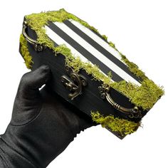 Step into the world of the strange and unusual with this Beetlejuice-inspired coffin trinket box. Featuring iconic black-and-white stripes, this coffin-shaped box is perfect for storing jewelry, keepsakes, or small treasures. A must-have for Halloween lovers, gothic décor fans, and Beetlejuice enthusiasts. Handmade with care, it's a spooky yet functional addition to any collection! 💚🖤 Wood coffin measures close to 6.5" x 3.5"  Made with Real moss. Please keep in mind. This item is handmade may Halloween Coffin Decoration, Wood Coffin, Goth Apartment, Storing Jewelry, Coffin Box, Halloween Coffin, Strange And Unusual, Halloween Lovers, Gothic Decor