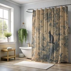 a bathroom with a shower curtain that has a cat on it and a bathtub in the corner