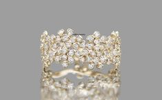 a diamond cluster ring, by cartonnieri & co 2 / 4 carat total weight