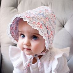 Our classic girl's bonnet made with a darling floral print in pastel hues helps protect little faces from the sun. Eyelet lace trim around the brim makes this even more feminine. Elastic at back of neck adds a bit of fit. This ties closed to keep bonnet in place. Perfect for the beach, and everyday wear, this lightweight hat is functional and cute. It has a UPF 25+ rating. • Shell: 100% Cotton, Lining: 65% Cotton, 35% Polyester• Cold handwash, Lay flat to dry• Made in China Classic Girl, Baby Bonnets, Pastel Hues, Cozy Fits, Eyelet Lace, Infants, Sun Hats, Lay Flat, Baby Toddler