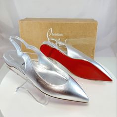 Nwt$795 Louboutin Hot Chickita Silver Leather Slingback Flats Sz 38 (Left Shoe) And 38.5 (Right Shoe) **Half Size Difference Between The Pair- Hardly Noticeable Difference Since It's A Slingback** Christian Louboutin's Hot Chickita Flats Are Crafted Of Metallic Leather With A Scalloped Slingback Strap. Leather Upper Point Toe Slips On Tpu Sole Made In Italy Brand New From Saks Fifth Avenue!! Strikeout To Prevent Returns Back To Saks. 100% Authentic With Original Box!! Tags: Fall, Autumn, Hallowe Designer Slingback Pumps With Red Sole, Luxury Slingback Pumps With Red Sole And Pointed Toe, Designer Slingback Pumps With Red Sole For Formal Occasions, Silver Slingback Pumps With Branded Heel For Evening, Silver High Heel Luxury Slingback Pumps, Luxury Silver Slingback Pumps With Heel Strap, Luxury Silver High Heel Slingback Pumps, Luxury Slingback Pumps With Flat Heel For Formal Occasions, Classic Slingback Pumps With Red Sole For Evening