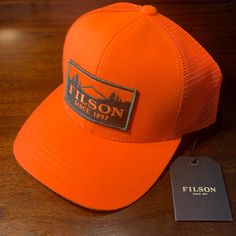 C.C. Filson Logger Mesh Cap, Trucker Hat, Filson Hat, Blaze Orange Orange Baseball Cap For Outdoor, Orange Curved Brim Hat For Outdoor, Orange Curved Brim Snapback Hat For Outdoor, Orange Snapback Hat With Curved Brim For Outdoor, Outdoor Orange Snapback Hat With Curved Brim, Orange Curved Brim Trucker Hat For Outdoor, Olive Tan, Vintage Bucket, Hunting Hat