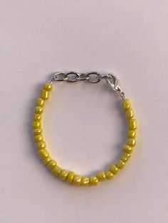 "This lovely bright yellow is the perfect color! It'll add a great POP of color to any little munchkins outfit!  Sizing options are based on the average \"universal\" sizes for babies and toddlers, but I'm happy to customize the fit for you. If you would like a custom fit please measure your child's wrist and send me measurement in inches. Adult sizes can be made for an extra charge. Choking hazard. Children should always be supervised while wearing jewelry. Keep bracelets away from water to maintain lasting quality.  Lead free materials used. Made in a smoke free and pet free home." Keep Bracelet, Toddler Bracelet, Halloween Bracelet, Wearing Jewelry, Baby Bracelet, Mesa Az, Bracelet Beaded, Lemon Yellow, Bright Yellow