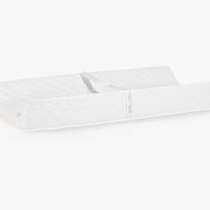 two white mattresses sitting side by side on top of each other in front of a white background