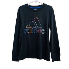 Adidas Long Sleeve T-Shirt Boys Size 5 In Black With A Colorful Logo, Nwt 100% Cotton Adidas Multicolor Graphic Print T-shirt, Sporty Multicolor Adidas Tops, Adidas Sporty Multicolor Tops, Adidas Multicolor Crew Neck T-shirt, Adidas Multicolor Graphic Print Tops, Adidas Long Sleeve Top With Logo Print, Adidas Multicolor Casual Tops, Adidas Long Sleeve Cotton T-shirt, Sporty Multicolor Long Sleeve T-shirt