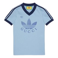 Gucci x adidas SS22 V-Neck T-Shirt 'Light Blue' 693636-XJEBZ-4709 Sporty Logo T-shirt For Sports, Blue T-shirt With Logo For Streetwear, Blue T-shirt With Three Stripes Branding For Streetwear, Blue Sportswear T-shirt For Sports Season, Blue Athleisure Tops With Three Stripes, Gucci Sporty Tops With Letter Print, Sporty Gucci Tops With Letter Print, Blue Sportswear Top With Three Stripes Branding, Blue Sportswear Top With Three Stripes