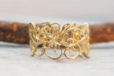 "An exceptional solid gold filigree ring with 3 diamonds. An Art Nouveau solid gold and diamonds ring.  This delicate ring entwined branches and leaves all around it 3 gold flowers are set among the flora - each one has a sparkly diamond in the center.  This lacy Ring is 13.5mm wide at the front and 7.5mm wide at the back for a comfortable fit, making this diamond ring perfect for everyday use as for any high-class event.  This Gold Filigree Ring would make a perfect engagement ring.  Make your Gold Filigree Ring With Diamond Accents For Promise, Gold Diamond Ring With Intricate Design, Gold Filigree Diamond Ring For Anniversary, Elegant Gold Filigree Ring With Diamond Accents, Gold Filigree Ring With Diamond Accents, Gold Filigree Ring With Diamond Accents As Gift, Gold Diamond Filigree Ring For Anniversary, Gold Filigree Ring With Single Cut Diamonds For Anniversary, Exquisite Gold Filigree Ring With Intricate Design