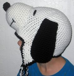 a person wearing a crocheted panda bear hat