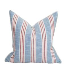 a blue and red striped pillow on a white background