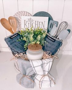 a kitchen gift basket with utensils and cookbooks